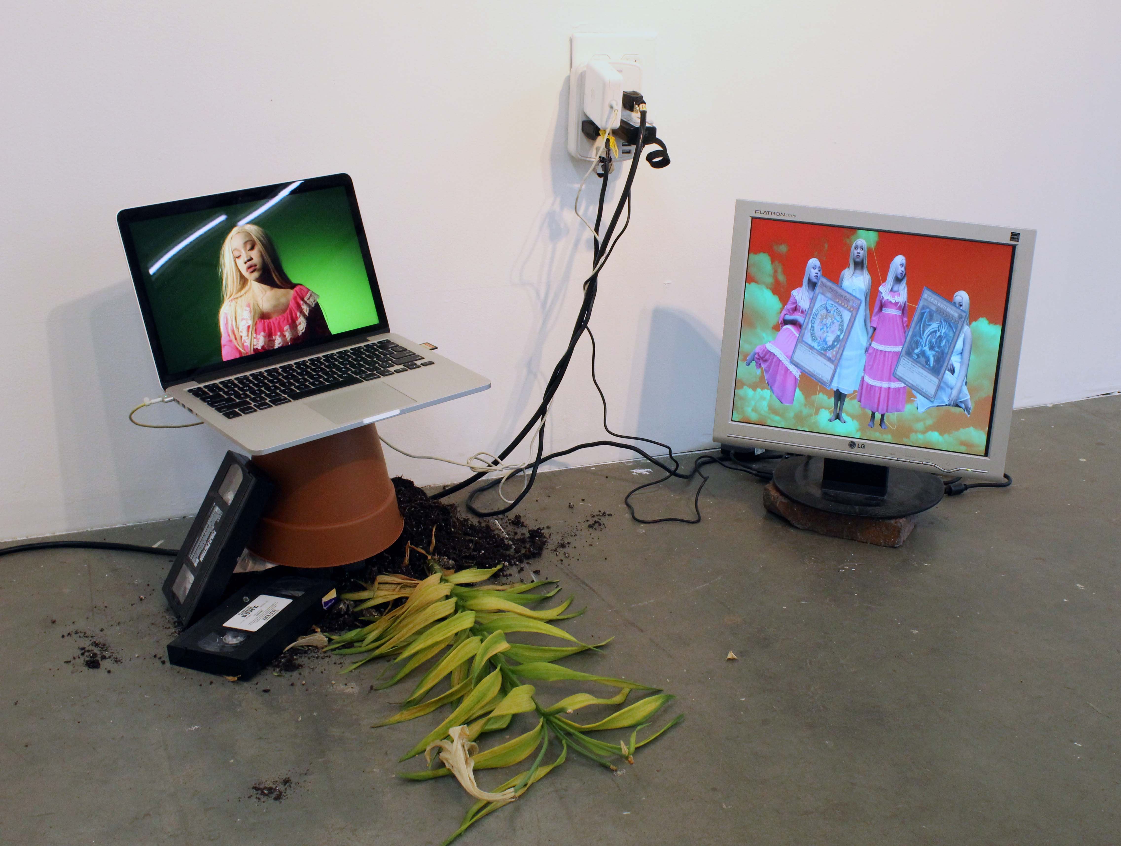 DARKMAGICIANGIRL ☆ two-channel video ☆ dead peace-lilies, plastic pot, blockbuster VHS tapes, dirt, bricks, two screens ☆ 2023